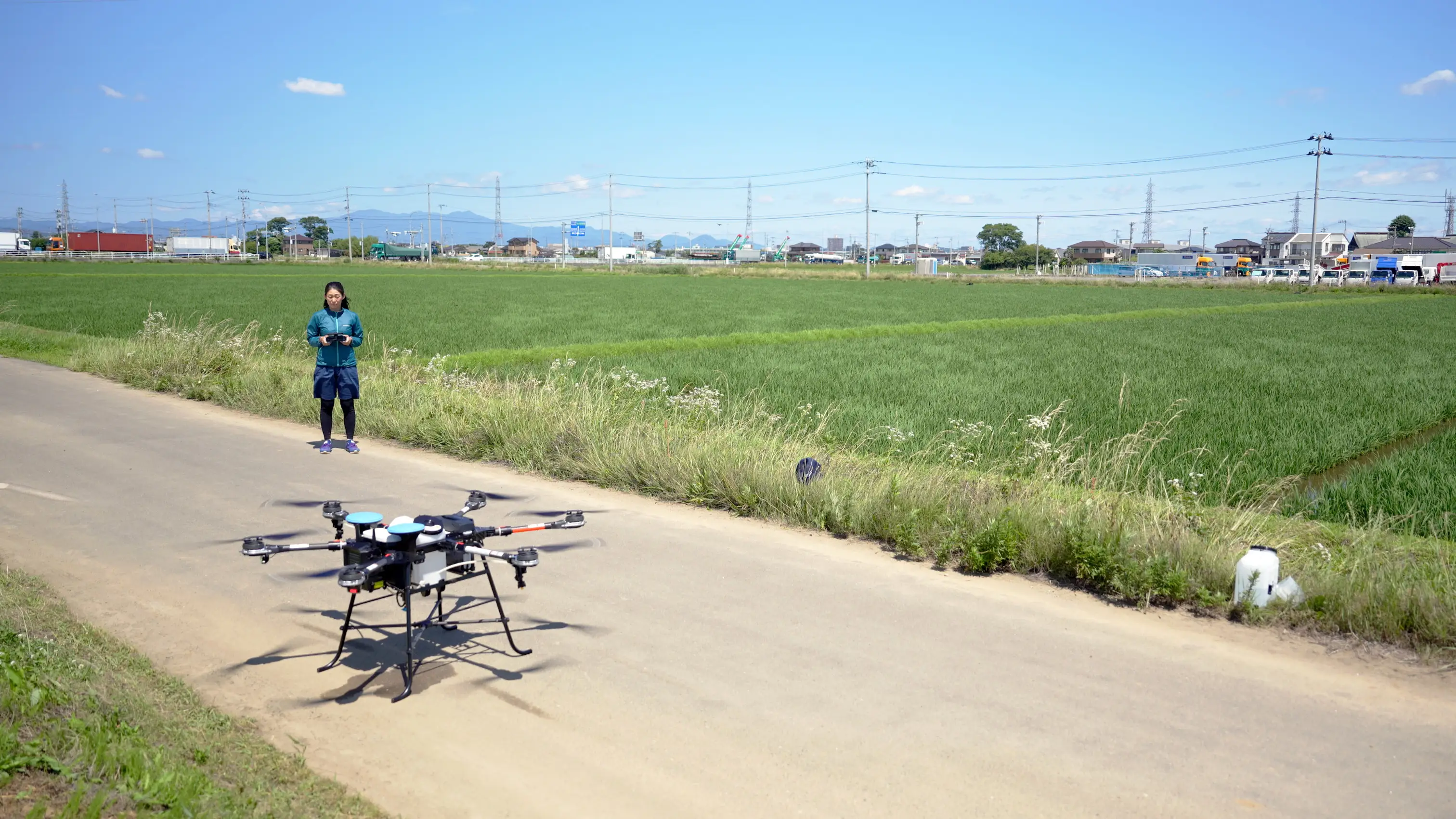 A figure piloting a drone.