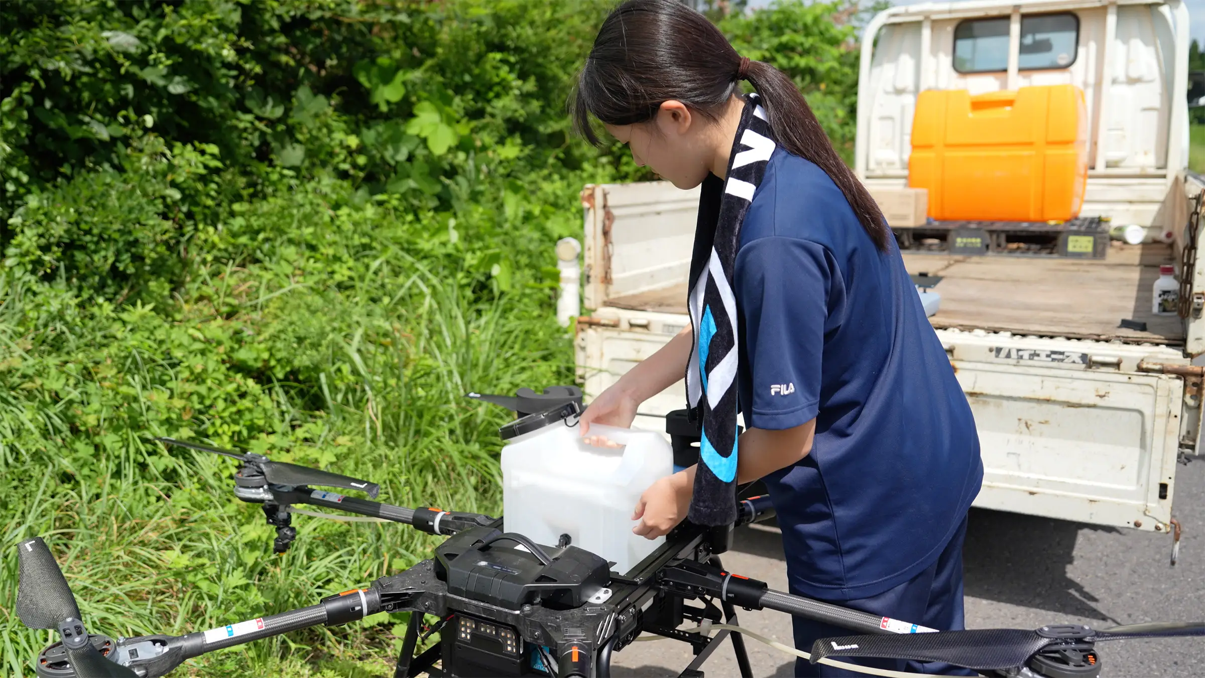 High school students preparing a drone.