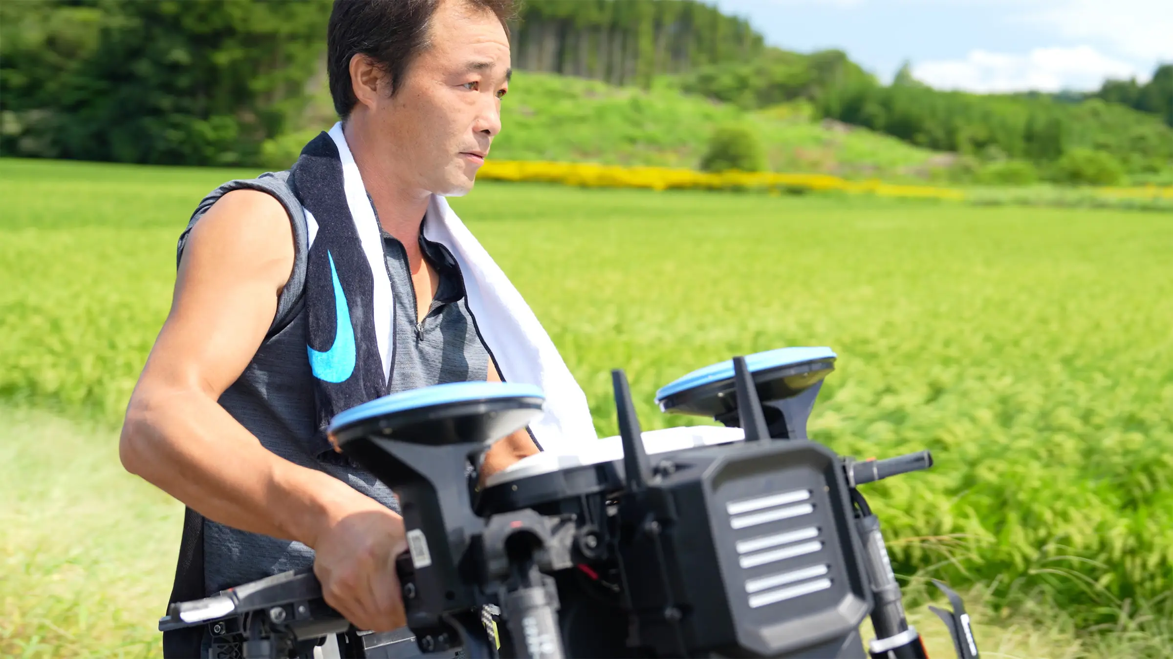 Father carrying drone.